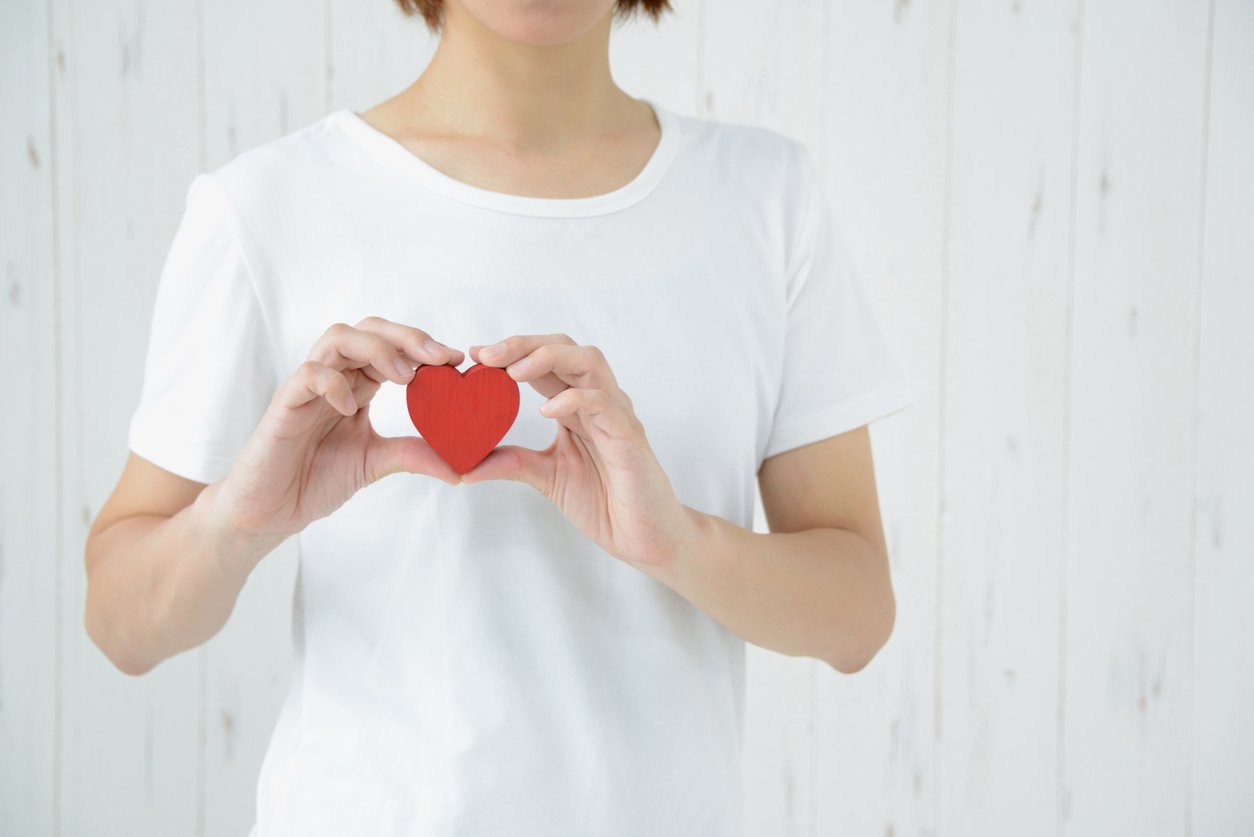 Woman having heart on bosom